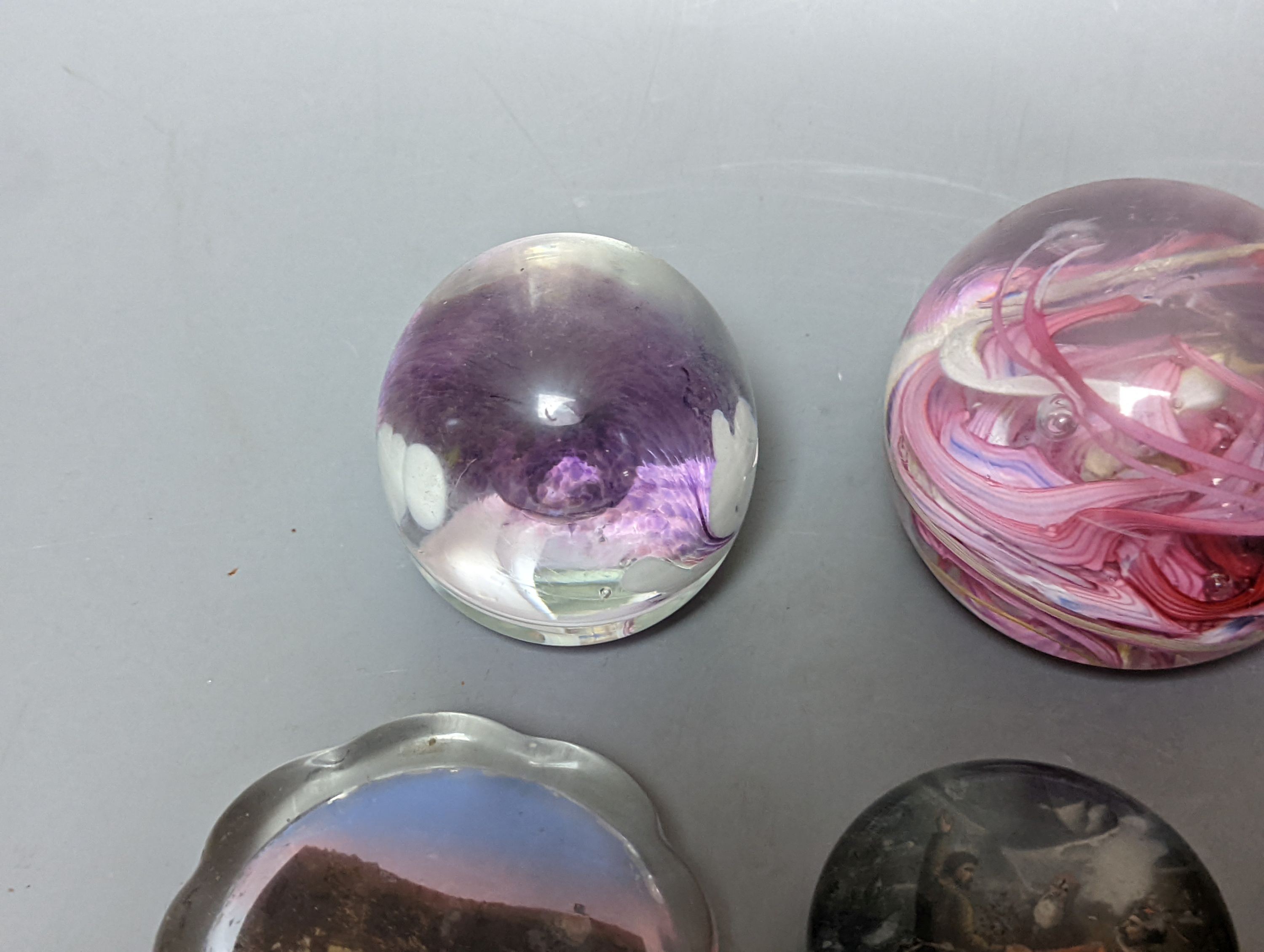 Nine various glass paperweights